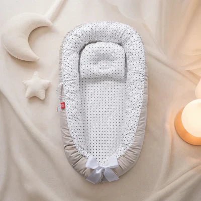 Réducteur de lit bébé dangereux ou pas ? - Mon Bébé Dort